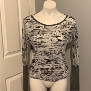 Gray and white long sleeve top with silver studs.